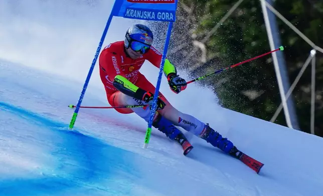 Switzerland's Marco Odermatt competes during an alpine ski, men's World Cup giant slalom, in Kranjska Gora, Slovenia, Saturday, March 7, 2026. (AP Photo/Pier Marco Tacca)