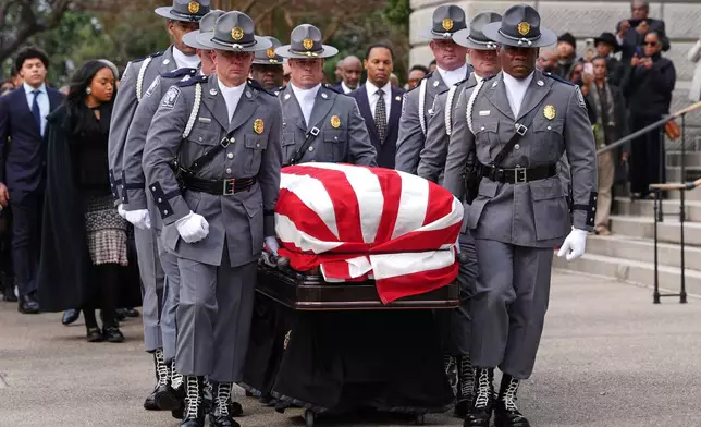 The casket of the Rev. Jesse Jackson is carried to the South Carolina Statehouse, where he will lie in state, Monday, March 2, 2026, in Columbia, S.C. (AP Photo/Matt Kelley, Pool)