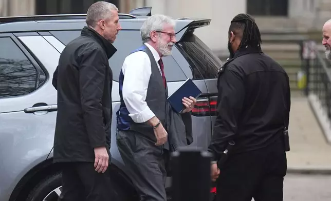 Former Sinn Fein president Gerry Adams, center, arrives at the Royal Courts of Justice, where a civil claim is being brought against him, in London, Monday March 9, 2026. ( James Manning/PA via AP)
