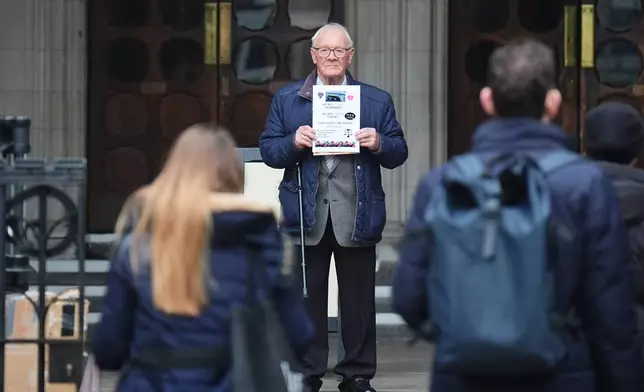 Claimant Barry Laycock poses for a photo outside the Royal Courts of Justice, where a civil claim is being brought against former Sinn Fein president Gerry Adams by three men who were injured in Provisional IRA bombings on the UK mainland in the 1970s and 1990s, in London, Monday March 9, 2026. (James Manning/PA via AP)