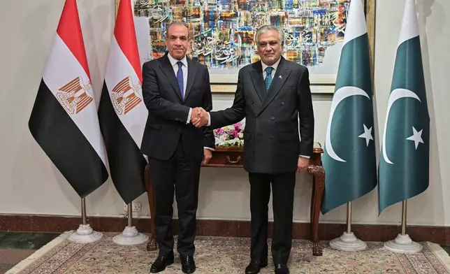 In this photo released by the Pakistan Ministry of Foreign Affairs, Egyptian Foreign Minister Badr Abdelatty, left, shakes hands with Pakistan's Foreign Minister Ishaq Dar prior to their meeting in Islamabad, Pakistan, Sunday, March 29, 2026. (Pakistan Ministry of Foreign Affairs via AP)