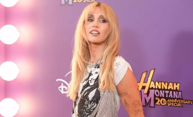 Miley Cyrus arrives at the premiere of "Hannah Montana 20th Anniversary Special" on Monday, March 23, 2026, at El Capitan Theatre in Los Angeles. (AP Photo/Chris Pizzello)