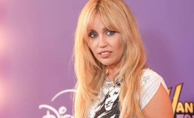 Miley Cyrus arrives at the premiere of "Hannah Montana 20th Anniversary Special" on Monday, March 23, 2026, at El Capitan Theatre in Los Angeles. (AP Photo/Chris Pizzello)