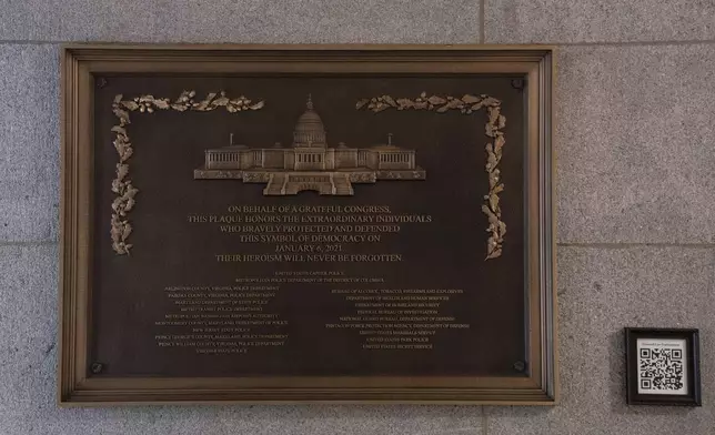 A plaque honoring police service on Jan. 6, 2021 at the Capitol, Saturday, March 7, 2026, in Washington. (AP Photo/Allison Robbert)