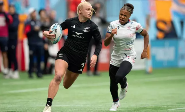 New Zealand's Jorja Miller, left, runs the ball to score a try as USA's Ariana Ramsey, chases during Vancouver Sevens women's semifinal rugby action, in Vancouver, on Sunday, March 8, 2026. (Ethan Cairns/The Canadian Press via AP)