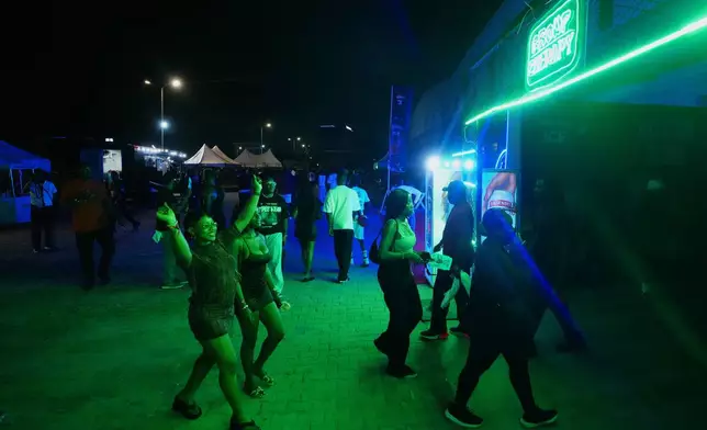 People arrive for a Group Therapy rave in Lekki, an upscale part of Lagos, Nigeria, early Saturday, Feb. 28, 2026. (AP Photo/Sunday Alamba)