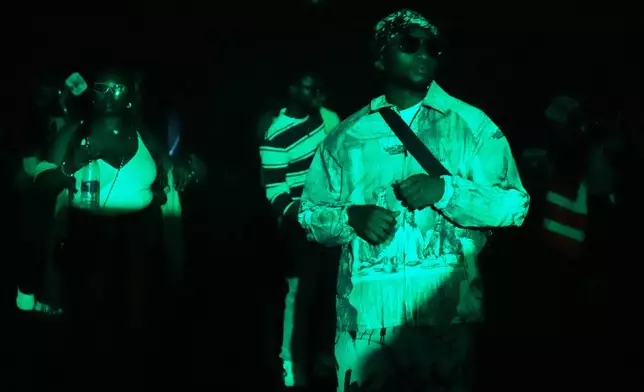 People dance during a Group Therapy rave in Lekki, an upscale part of Lagos, Nigeria, Saturday, Feb. 28, 2026. (AP Photo/Sunday Alamba)