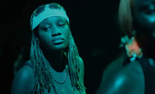 DJ Aniko dances before performing at a Group Therapy rave in Lekki, an upscale part of Lagos, Nigeria, early Saturday, Feb. 28, 2026. (AP Photo/Sunday Alamba)