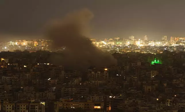 Smoke rises from the site of an Israeli airstrike in Dahiyeh, Beirut's southern suburbs, Monday, March 23, 2026. (AP Photo/Hassan Ammar)