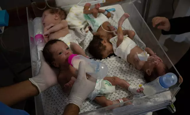 FILE - Medics prepare premature babies for transport to Egypt after they were evacuated from Shifa Hospital in Gaza City to a hospital in Rafah, Gaza Strip, Monday, Nov. 20, 2023. (AP Photo/Fatima Shbair, File)