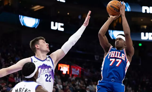 Philadelphia 76ers guard VJ Edgecombe (77) looks to shoot over Utah Jazz center Kyle Filipowski (22) during the first half of an NBA basketball game, Saturday, March 21, 2026, in Salt Lake City. (AP Photo/Anna Fuder)