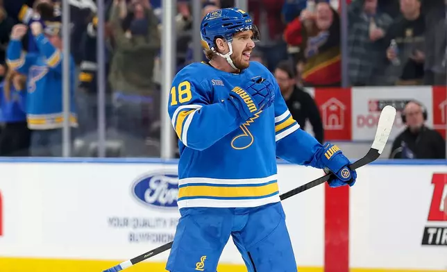 St. Louis Blues' Robert Thomas (18) reacts after scoring during the overtime period of an NHL hockey game against the Edmonton Oilers Friday, March 13, 2026, in St. Louis. (AP Photo/Scott Kane)
