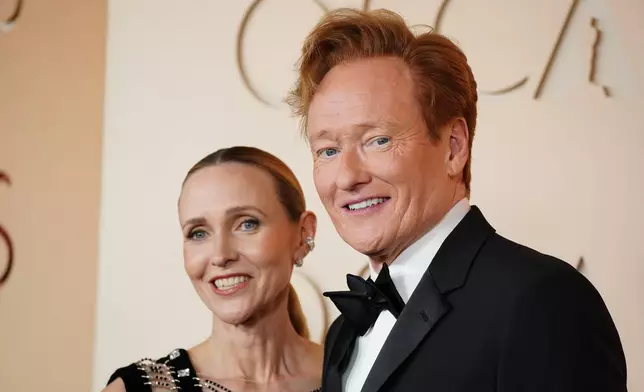Liza Powel O'Brien, left, and Conan O'Brien arrive at the Oscars on Sunday, March 15, 2026, at the Dolby Theatre in Los Angeles. (Photo by Jordan Strauss/Invision/AP)