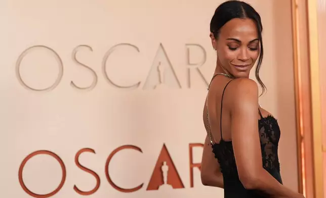 Zoe Saldaña arrives at the Oscars on Sunday, March 15, 2026, at the Dolby Theatre in Los Angeles. (AP Photo/Gregory Bull)