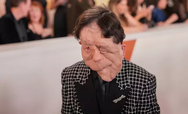 Adam Pearson arrives at the Oscars on Sunday, March 15, 2026, at the Dolby Theatre in Los Angeles. (AP Photo/John Locher)