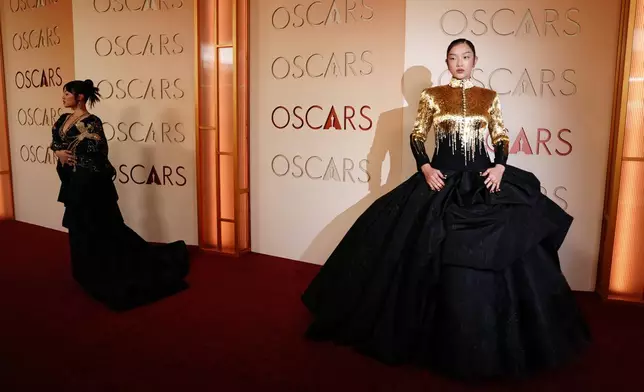 Rei Ami, left, and Audrey Nuna arrive at the Oscars on Sunday, March 15, 2026, at the Dolby Theatre in Los Angeles. (Photo by Jordan Strauss/Invision/AP)