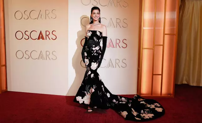 Anne Hathaway arrives at the Oscars on Sunday, March 15, 2026, at the Dolby Theatre in Los Angeles. (Photo by Jordan Strauss/Invision/AP)