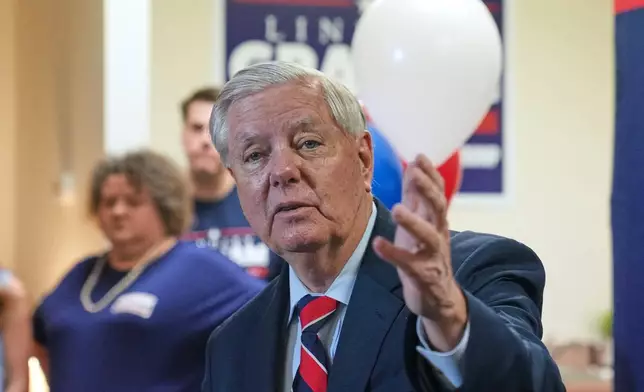 Sen. Lindsey Graham, R-S.C., speaks with supporters after filing his reelection paperwork Monday, March 16, 2026, in Columbia, S.C. (AP Photo/Meg Kinnard)
