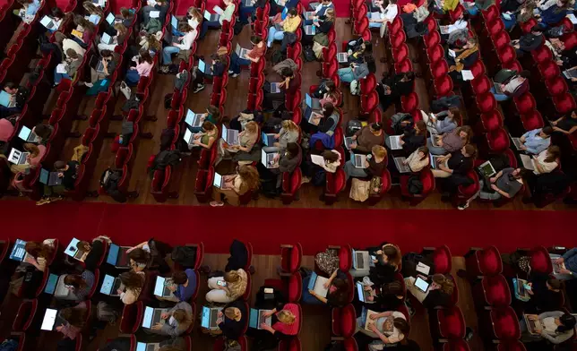 Students use their laptops while studying with music at Concertgebouw in Amsterdam, Netherlands, on March 5, 2026. (AP Photo/Peter Dejong)