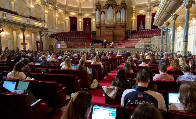 Students use their laptops while studying with music at Concertgebouw in Amsterdam, Netherlands, on March 5, 2026. (AP Photo/Peter Dejong)