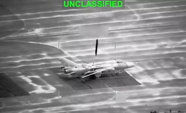 This partially redacted image from video provided by U.S. Central Command shows a military aircraft in Iran shortly before it was struck by a missile fired by U.S. forces on Sunday, March 1, 2026. (U.S. Central Command via AP)