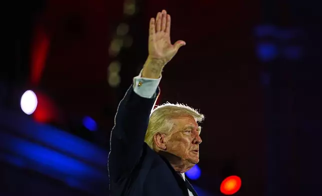 President Donald Trump waves after speaking at the National Republican Congressional Committee's (NRCC) annual fundraising dinner, Wednesday, March 25, 2026, at Union Station in Washington. (AP Photo/Julia Demaree Nikhinson)
