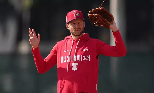 Philadelphia Phillies' Trea Turner reacts during spring training baseball Monday, Feb. 16, 2026, in Clearwater, Fla. (AP Photo/Matt Slocum)