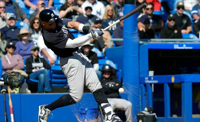 New York Yankees' Aaron Judge connects for a single off Toronto Blue Jays pitcher Jesse Hahn during the fifth inning of a spring training baseball game Tuesday, Feb. 24, 2026, in Dunedin, Fla. (AP Photo/Chris O'Meara)