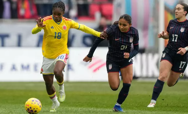 Colombia forward Linda Caicedo (18) drives past United States forward Alyssa Thompson (21) during the first half of a SheBelieves Cup women's soccer match, Saturday, March 7, 2026, in Harrison, N.J. (AP Photo/Yuki Iwamura)