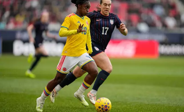 Colombia forward Linda Caicedo (18) drives past United States midfielder Sam Coffey (17) during the first half of a SheBelieves Cup women's soccer match, Saturday, March 7, 2026, in Harrison, N.J. (AP Photo/Yuki Iwamura)