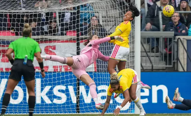 Colombia goalkeeper Claudia Dickey (1) blocks a shot during the first half of a SheBelieves Cup women's soccer match against the United States, Saturday, March 7, 2026, in Harrison, N.J. (AP Photo/Yuki Iwamura)