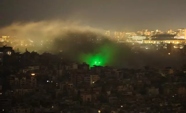 Smoke rises from the site of an Israeli airstrike in Dahiyeh, Beirut's southern suburbs, Monday, March 23, 2026. (AP Photo/Hassan Ammar)