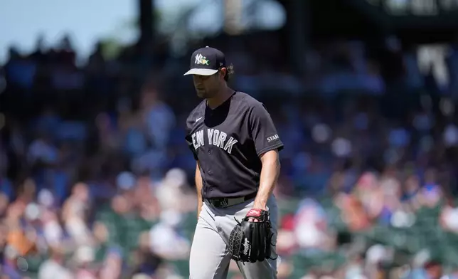 New York Yankees starting pitcher Gerrit Cole walks off the field after his pitching outing during the second inning of a spring training baseball game against the Chicago Cubs, Tuesday, March 24, 2026, in Mesa, Ariz. (AP Photo/Ross D. Franklin)