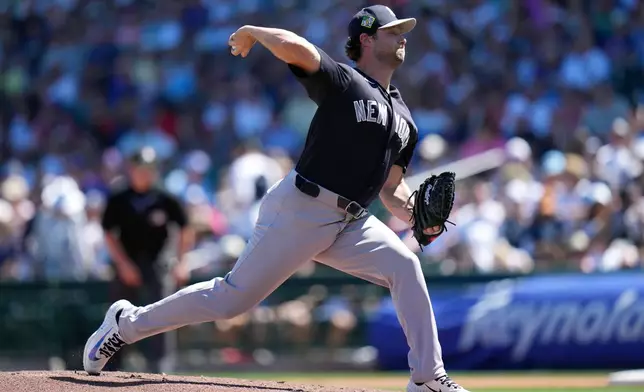 New York Yankees starting pitcher Gerrit Cole throws against the Chicago Cubs during the first inning of a spring training baseball game, Tuesday, March 24, 2026, in Mesa, Ariz. (AP Photo/Ross D. Franklin)