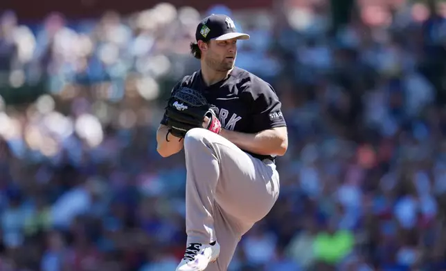 New York Yankees starting pitcher Gerrit Cole throws against the Chicago Cubs during the first inning of a spring training baseball game, Tuesday, March 24, 2026, in Mesa, Ariz. (AP Photo/Ross D. Franklin)