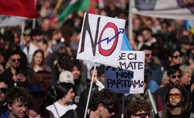 People take part in a national anti-war demonstration organized by "No Kings Italy movement" in Rome, Saturday, March 28, 2026. (AP Photo/Andrew Medichini)