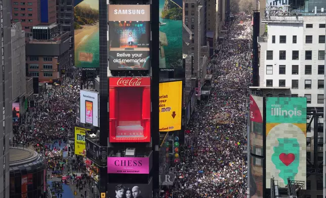 People attend a "No Kings" protest Saturday, March 28, 2026, in New York. (AP Photo/Adam Gray)
