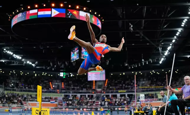 Jorge A. Hodelin, of Cuba, makes an attempt in the men's long jump final at the World Athletics Indoor Championships in Torun, Poland, Sunday, March 22, 2026. (AP Photo/Matthias Schrader)