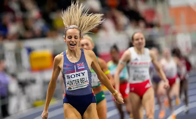 Georgia Hunter Bell, of Britain, reacts after crossing the finish line to win the gold medal in the women's 1500 meters final at the World Athletics Indoor Championships in Torun, Poland, Sunday, March 22, 2026. (AP Photo/Petr David Josek)