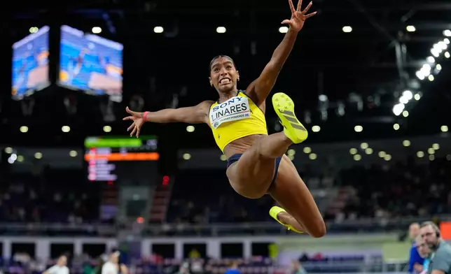 Natalia Linares, of Colombia, makes an attempt in the women's long jump final at the World Athletics Indoor Championships in Torun, Poland, Sunday, March 22, 2026. (AP Photo/Matthias Schrader)