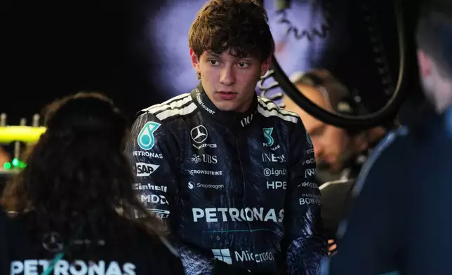 Mercedes driver Andrea Kimi Antonelli of Italy works with his team members in the garage in Suzuka, central Japan, Thursday, March 26, 2026, ahead of Sunday's Japanese Formula One Grand Prix race. (AP Photo/Hiro Komae)