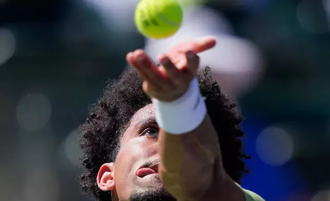 Arthur Fils, of France, serves against Alexander Zverev, of Germany, during a quarterfinal match at the BNP Paribas Open tennis tournament, Thursday, March 12, 2026, in Indian Wells, Calif. (AP Photo/Mark J. Terrill)