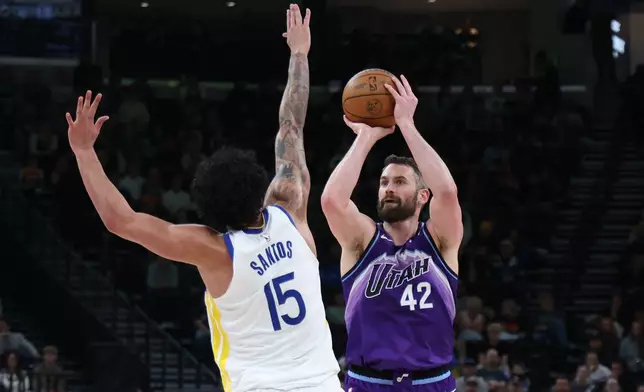 Utah Jazz forward Kevin Love (42) shoots over Golden State Warriors forward Gui Santos (15) during the first half of an NBA basketball game, Monday, March 9, 2026, in Salt Lake City. (AP Photo/Rob Gray)