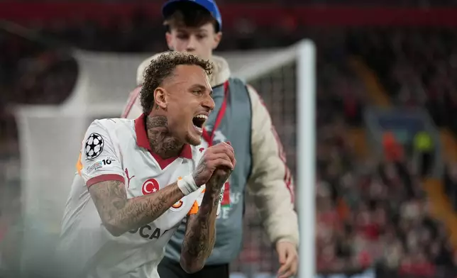 Galatasaray's Noa Lang reacts after sustaining an injury during the second leg of the Champions League round of 16 soccer match between Liverpool and Galatasaray, in Liverpool, England, Wednesday, March 18, 2026. (AP Photo/Jon Super)