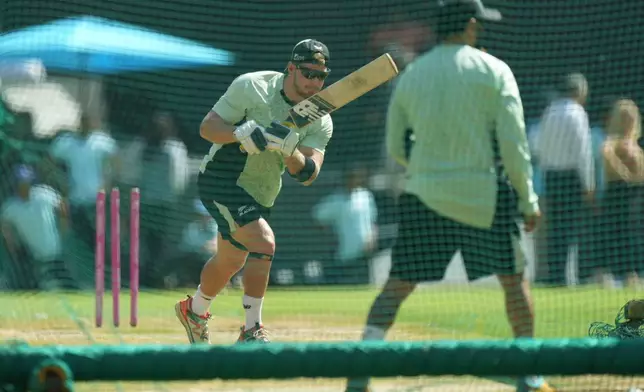 New Zealand's Glenn Phillips bats, left, bats during a practice session ahead of the T20 World Cup cricket final match against India in Ahmedabad, India, Saturday, March 7, 2026. (AP Photo/Ajit Solanki)