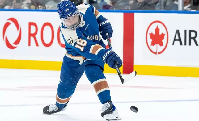 Vancouver Goldeneyes' Sophie Jaques (16) shoots the puck against the New York Sirens during the third period of a PWHL hockey game in Vancouver, British Columbia, Wednesday, March 18, 2026. (Ethan Cairns/The Canadian Press via AP)
