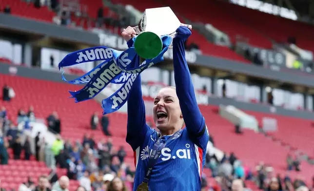 Chelsea's Johanna Rytting Kaneryd celebrates with the trophy after winning the Women's League Cup final, in Bristol, England, Sunday, March 15, 2026. (Steve Paston/PA via AP)
