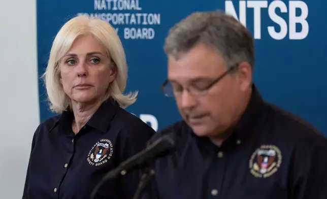Jennifer Homendy, the NTSB chair, listens to Doug Brazy, aviation accident investigator for the NTSB, speaks during a press conference, Tuesday, March 24, 2026, at LaGuardia Airport in New York. (AP Photo/Yuki Iwamura)