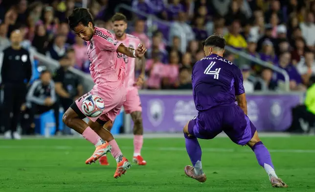 Inter Miami CF midfielder Telasco Segovia, left, stops the ball as he is chased by Orlando City SC defender David Brekalo (4) during the first half of an MLS soccer match, Sunday, March 1, 2026, in Orlando, Fla. (AP Photo/Kevin Kolczynski)