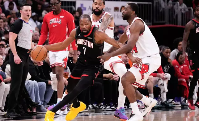 Houston Rockets forward Kevin Durant (7) drives against Chicago Bulls forward Patrick Williams during the first half of an NBA basketball game in Chicago, Monday, March 23, 2026. (AP Photo/Nam Y. Huh)